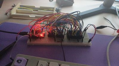 Picture of a breadboard with wires going from an Arduino NANO to two 74HC595 and the flash rom chip